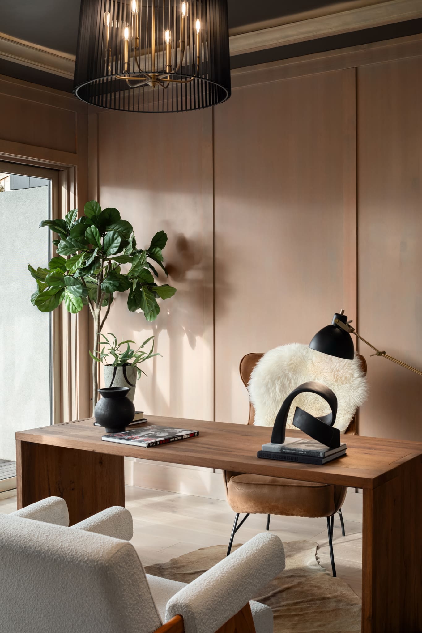 Modern home office featuring warm wood tones, a stylish desk, and elegant decor elements, located in the Pacific Northwest.