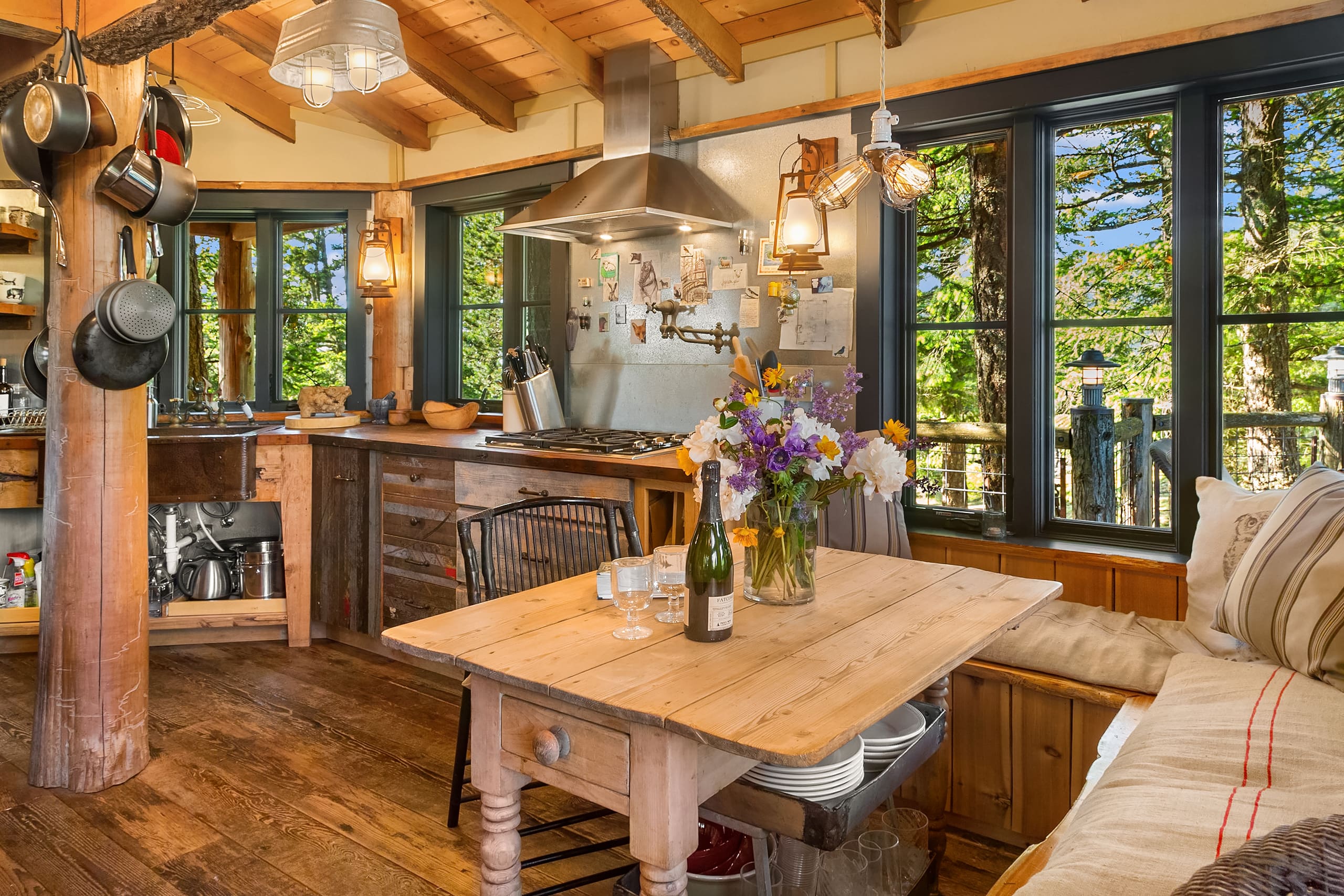 Cozy kitchen featuring rustic wood elements, modern appliances, and large windows that invite natural light, located in the Pacific Northwest.