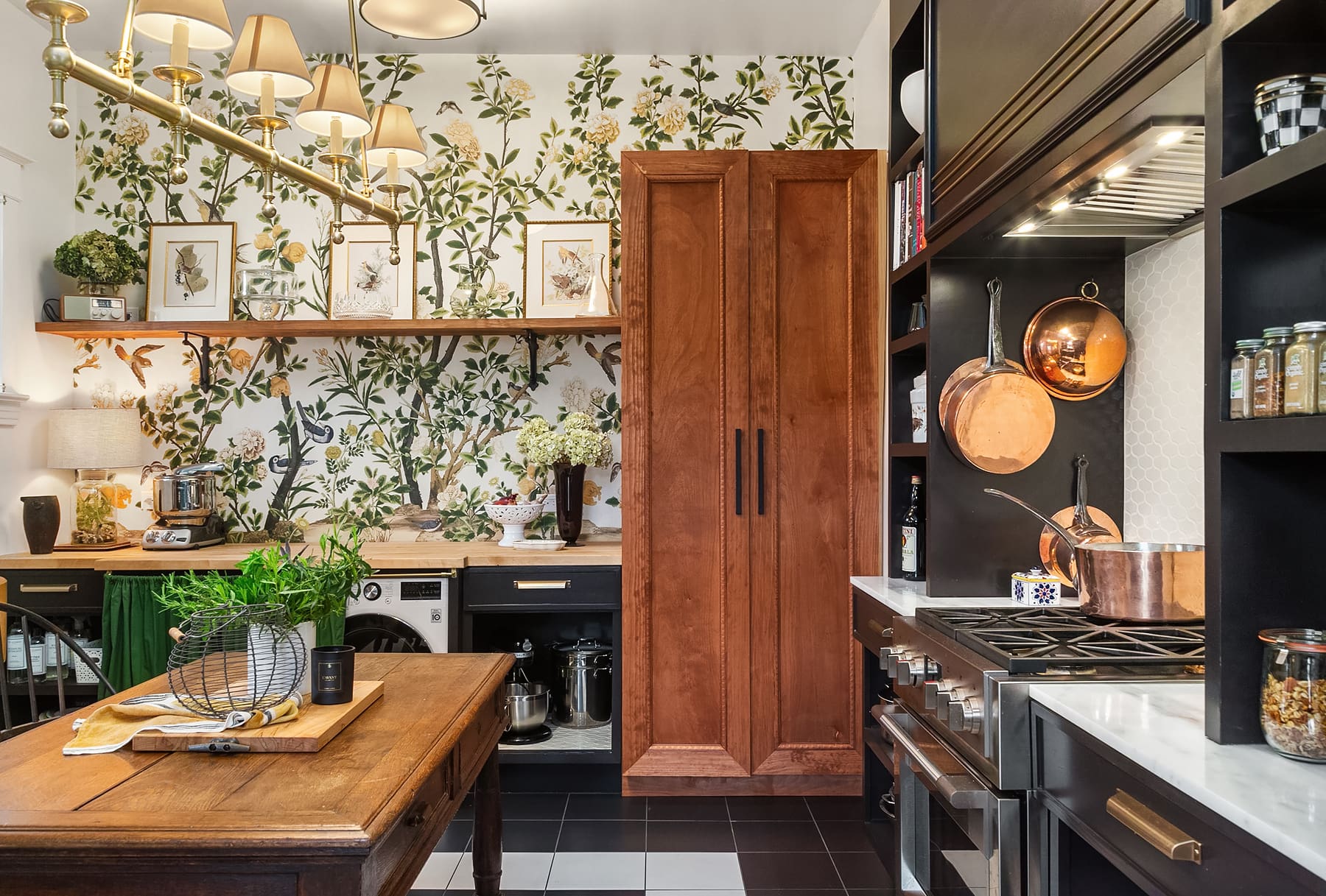 Charming modern kitchen featuring floral wallpaper, wooden accents, and sleek black cabinetry, located in the Pacific Northwest.