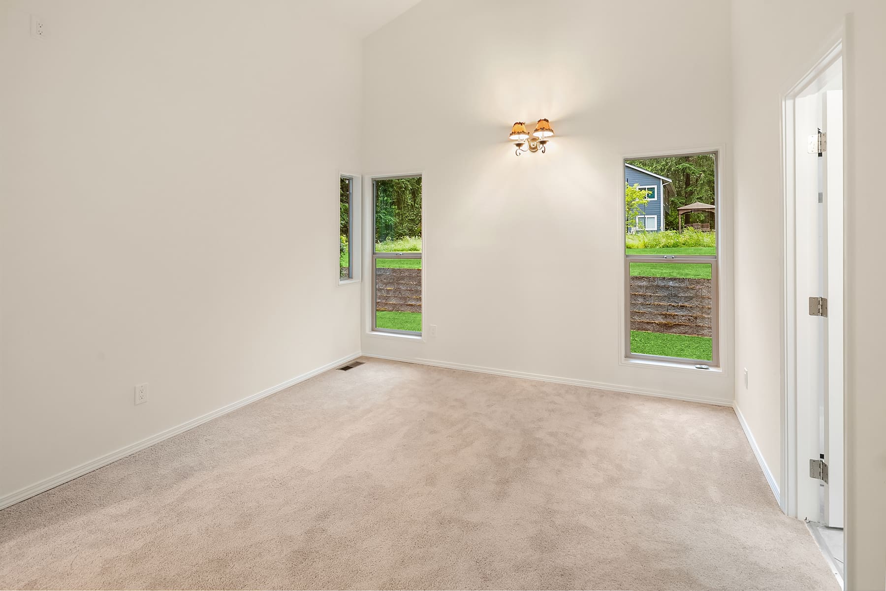 Bright, unfurnished living room with natural light and hardwood floors